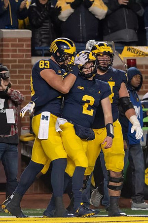 Zach Gentry (83), Shea Patterson (2), and Ben Bredeson (74)