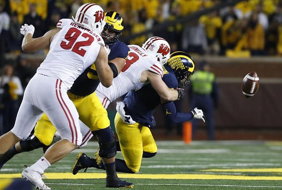 Jon Runyan Jr. (75) and Shea Patterson (2)