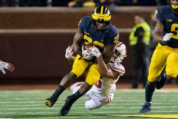 Karan Higdon (22) and Donovan Peoples-Jones (9)
