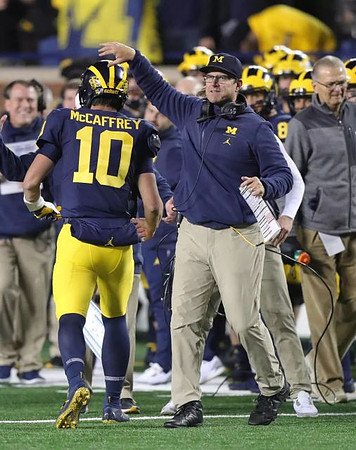Dylan McCaffrey (10) and Jim Harbaugh