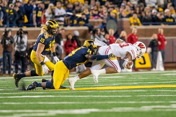 Chase Winovich (15) and Josh Metellus (14)