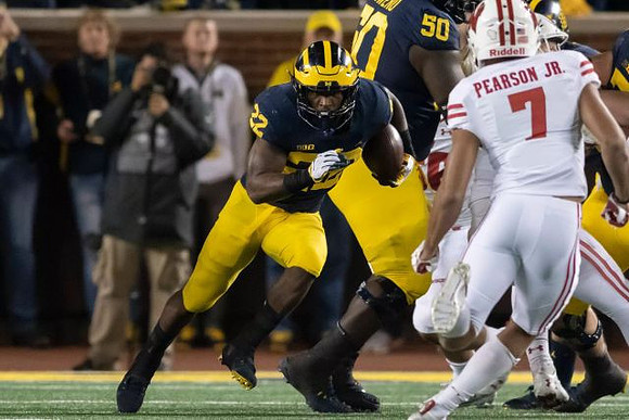 Karan Higdon (22) and Michael Onwenu (50)
