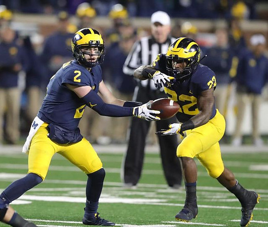 Shea Patterson (2) and Karan Higdon (22)