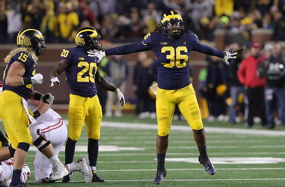 Chase Winovich (15), Brad Hawkins (20), and Devin Gil (36)