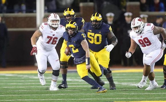 Shea Patterson (2), Juwann Bushell-Beatty (76), and Michael Onwenu (50)