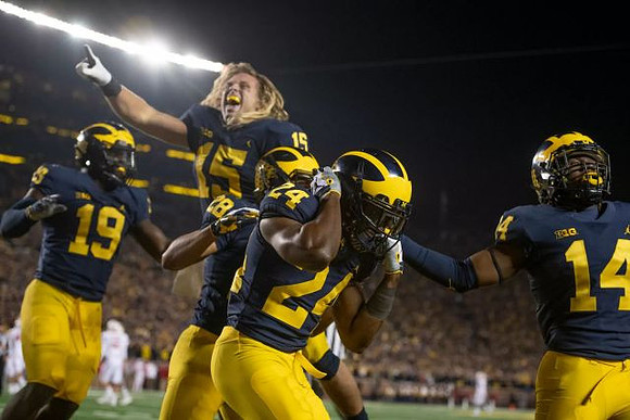 Kwity Paye (19), Chase Winovich (15), Brandon Watson (28), Lavert Hill (24), and Josh Metellus (14)