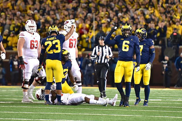 Tyree Kinnel (23), Lawrence Marshall (93), Josh Uche (6), and Khaleke Hudson (7)
