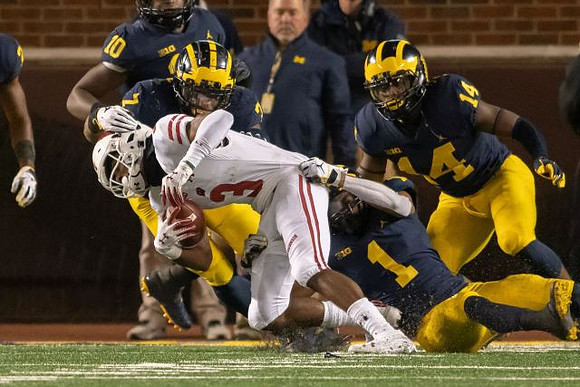 Devin Bush (10), Khaleke Hudson (7), Ambry Thomas (1), and Josh Metellus (14)