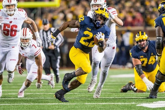 Karan Higdon (22) and Ben Bredeson (74)