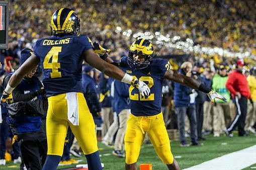 Nico Collins (4) and Karan Higdon (22)