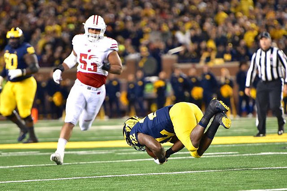 Michael Onwenu (50) and Karan Higdon (22)
