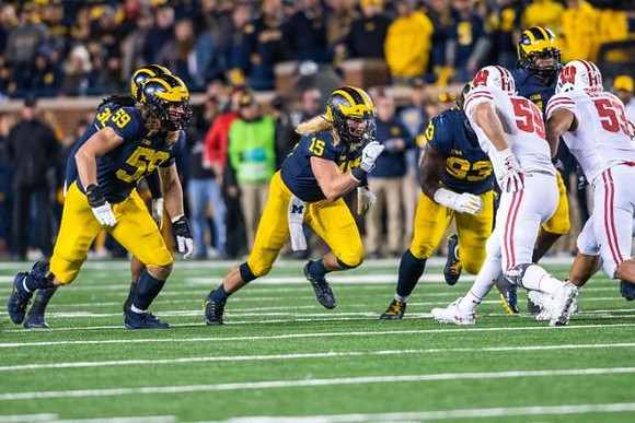 Devin Gil (36), Noah Furbush (59), Chase Winovich (15), and Lawrence Marshall (93)