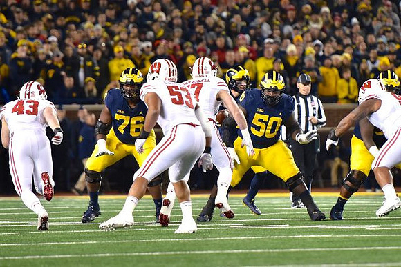 Juwann Bushell-Beatty (76), Shea Patterson (2), and Michael Onwenu (50)
