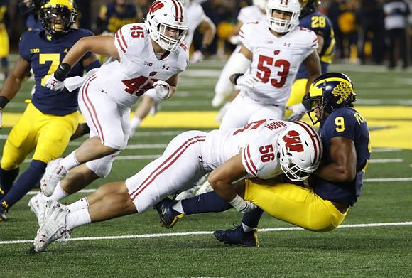 Khaleke Hudson (7) and Donovan Peoples-Jones (9)