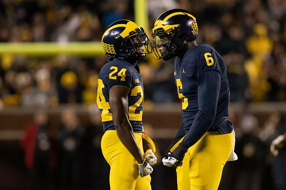 Lavert Hill (24) and Josh Uche (6)