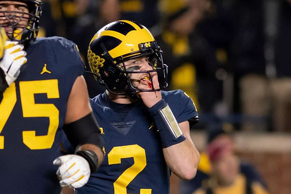 Jon Runyan Jr. (75) and Shea Patterson (2)