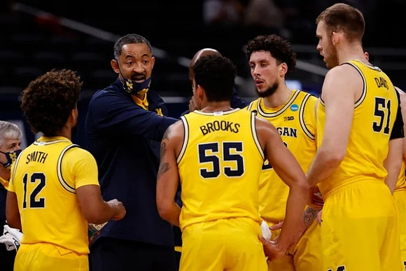 Mike Smith (12), Juwan Howard, Eli Brooks (55), Brandon Johns Jr. (23), and Austin Davis (51)
