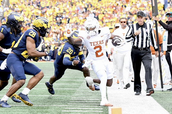 Jaishawn Barham (1), Quinten Johnson (28), and Jyaire Hill (20)
