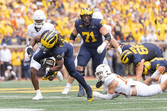 Donovan Edwards (7), Evan Link (71), Josh Priebe (68), and Dominick Giudice (56)