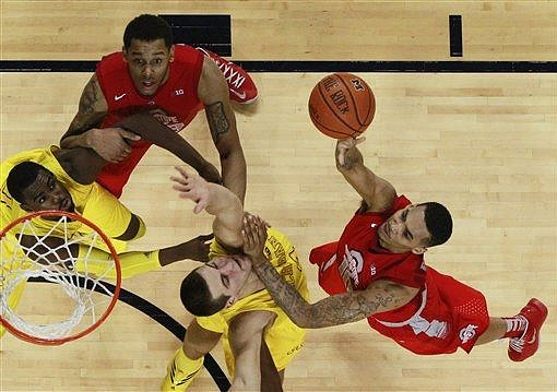 Mitch McGary (4) and Tim Hardaway Jr. (10)