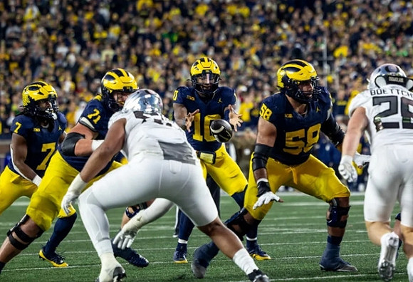 Donovan Edwards (7), Evan Link (71), Alex Orji (10), and Giovanni El-Hadi (58)