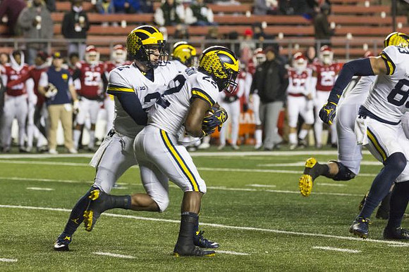Shea Patterson (2), Karan Higdon (22), and Zach Gentry (83)