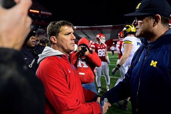 Rutgers Head Coach Chris Ash and Jim Harbaugh