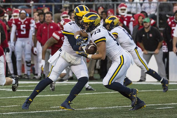 Shea Patterson (2), Tru Wilson (13), and Nick Eubanks (82)