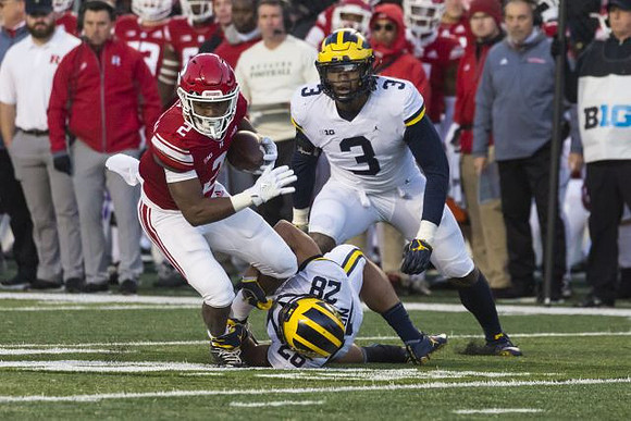 Brandon Watson (28) and Rashan Gary (3)