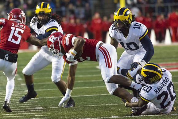 Devin Gil (36), Devin Bush (10), and Brad Hawkins (20)