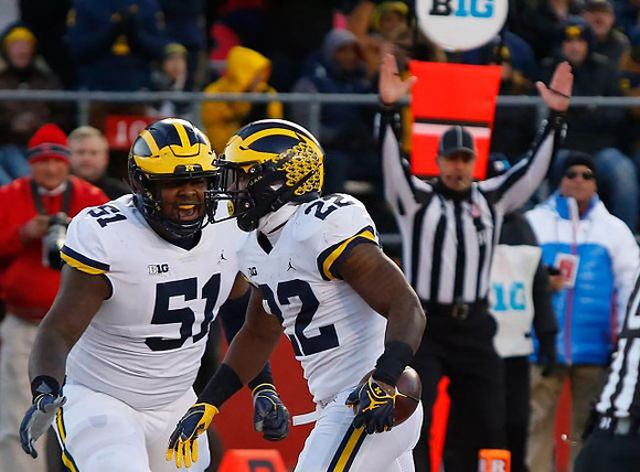 Cesar Ruiz (51) and Karan Higdon (22)