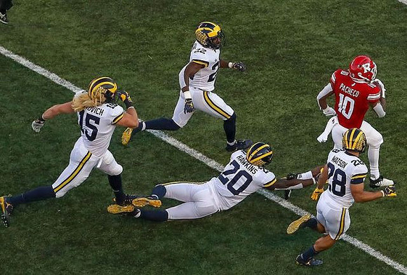 Chase Winovich (15), David Long (22), Brad Hawkins (20), and Brandon Watson (28)