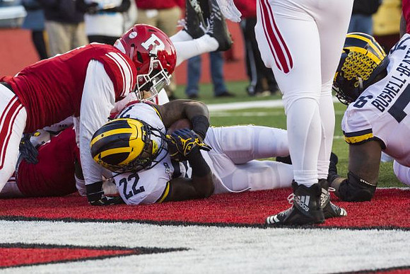 Karan Higdon (22) and Juwann Bushell-Beatty (76)