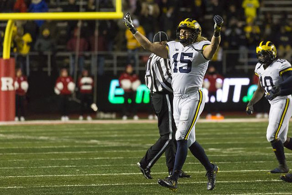 Chase Winovich (15) and Devin Bush (10)