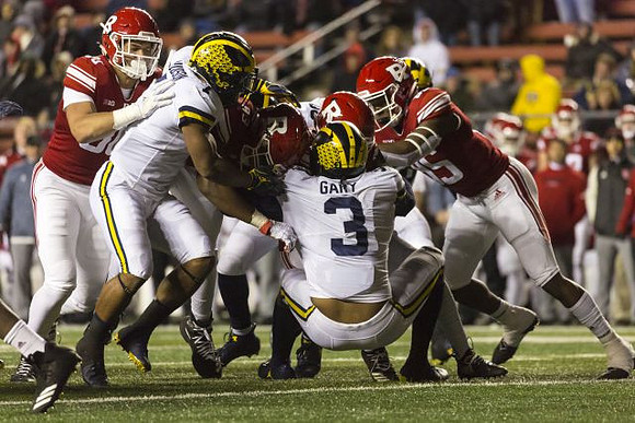 Khaleke Hudson (7) and Rashan Gary (3)