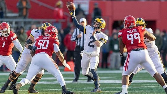 Ben Bredeson (74), Shea Patterson (2), and Jon Runyan Jr. (75)