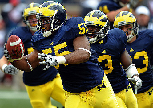 Brandon Graham (55), Stevie Brown (3), and Jon Conover (83)