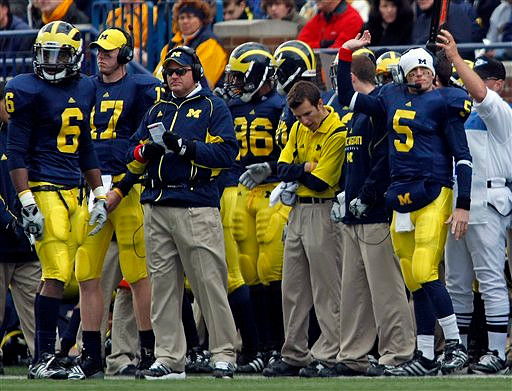 Donovan Warren (6), David Cone (17), Rich Rodriguez, Kevin Koger (86), and Tate Forcier (5)