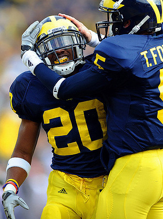 Michael Shaw (20) and Tate Forcier (5)