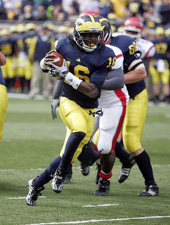 Denard Robinson (16) and David Moosman (60)