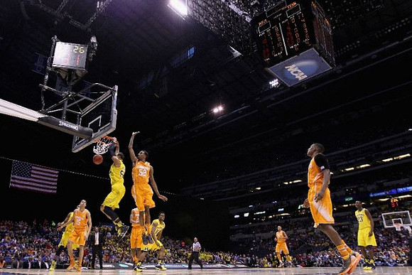 Jordan Morgan (52), Derrick Walton Jr. (10), and Caris LeVert (23)