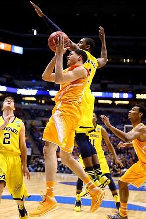 Spike Albrecht (2), Glenn Robinson III (1), and Zak Irvin (21)