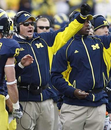 Jon Conover (83) and Rich Rodriguez