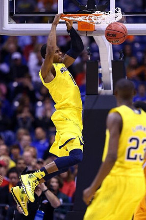 Glenn Robinson III (1) and Caris LeVert (23)