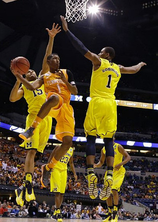 Jon Horford (15), Caris LeVert (23), and Glenn Robinson III (1)