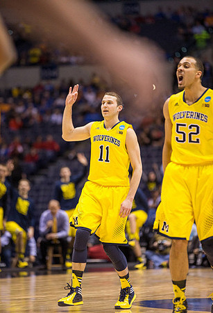 Nik Stauskas (11) and Jordan Morgan (52)
