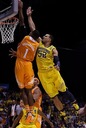 Jordan Morgan (52) and Derrick Walton Jr. (10)