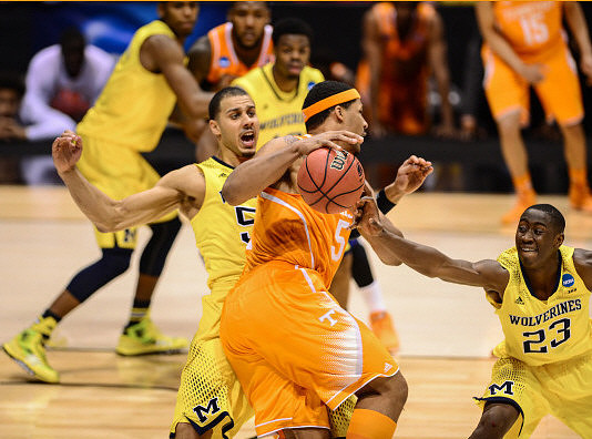 Glenn Robinson III (1), Derrick Walton Jr. (10), Jordan Morgan (52), and Caris LeVert (23)