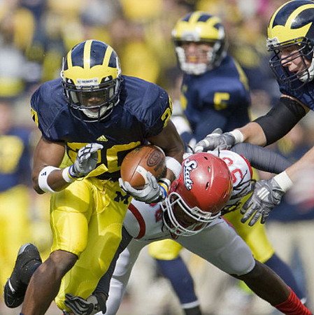 Michael Shaw (20) and Tate Forcier (5)