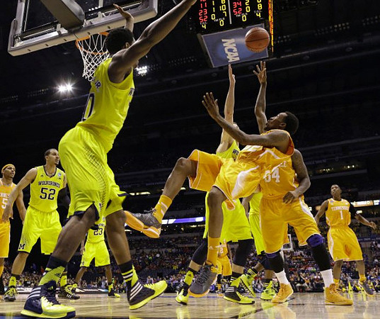 Jordan Morgan (52), Caris LeVert (23), and Nik Stauskas (11)